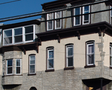 Reading apartment for rent - a large stone building with windows and a balcony