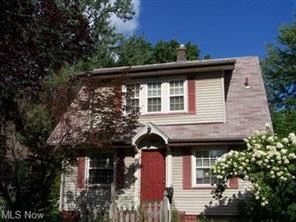 Warren house for rent - A house with a red door and a window with white trim.