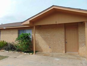 Marble Falls apartment for rent - the front of a brick house with a garage door