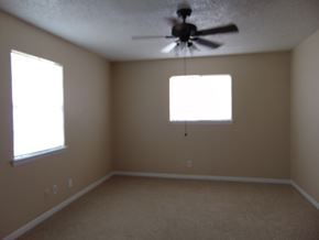 Marble Falls apartment for rent - a living room with a ceiling fan and two windows