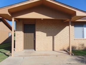 Marble Falls apartment for rent - the front of a brick house with a brown door