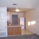 Marble Falls apartment for rent - A white door is open to a room with a grey carpet.