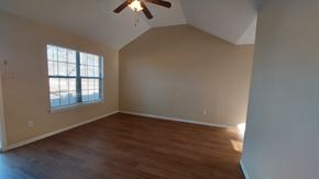 Marble Falls apartment for rent - A room with a ceiling fan and a window.