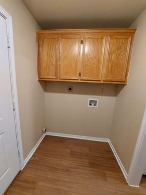 Marble Falls apartment for rent - A room with wooden floors and a white door.