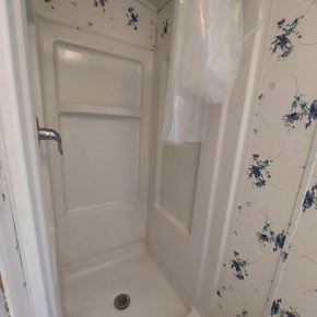Marble Falls apartment for rent - A white shower stall with a floral design on the wall.