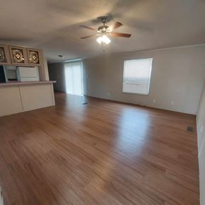 Marble Falls apartment for rent - A room with wooden flooring and a ceiling fan.