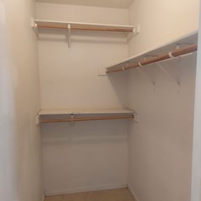 Marble Falls apartment for rent - Empty white closet with shelves and hooks.