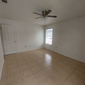 Marble Falls apartment for rent - A room with a ceiling fan and tile flooring.