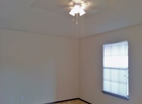 Marble Falls apartment for rent - the corner of a room with a ceiling fan and a window