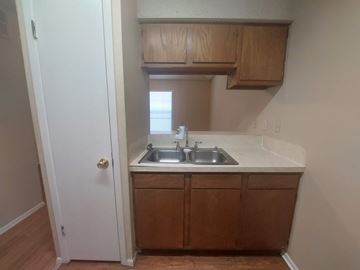 Marble Falls apartment for rent - A small kitchen with a sink and cabinets.