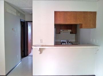 Marble Falls apartment for rent - A kitchen with a white counter top and a refrigerator.