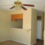 Marble Falls apartment for rent - A room with a ceiling fan and a white refrigerator.