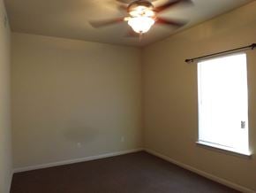 Marble Falls apartment for rent - A room with a ceiling fan and a window.
