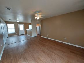 Marble Falls apartment for rent - A room with a ceiling fan and wooden flooring.