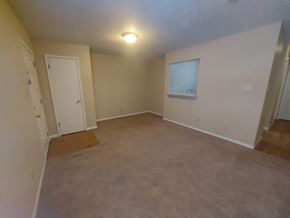 Marble Falls apartment for rent - A room with a carpeted floor and a window.