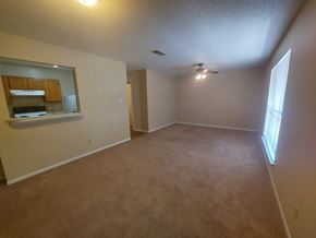 Marble Falls apartment for rent - A room with a carpeted floor and a window letting in sunlight.