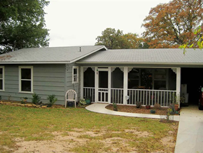 Granite Shoals apartment for rent - A house with a grey roof and a white porch.