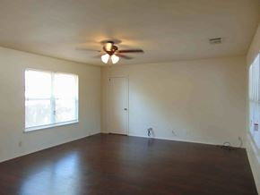 Granite Shoals apartment for rent - A room with a ceiling fan and a door.