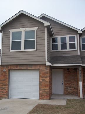 Marble Falls apartment for rent - A house with a grey roof and a white garage door.