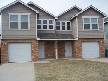 Marble Falls apartment for rent - A two-story house with a garage on the first floor.