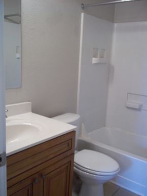 Marble Falls apartment for rent - a bathroom with a toilet and a sink and a tub