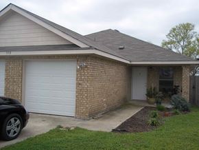 Marble Falls apartment for rent - a brick house with a white garage door