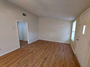 Marble Falls apartment for rent - A room with wooden flooring and white walls.
