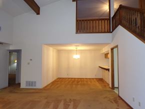 Marble Falls apartment for rent - A room with wooden floors and a staircase.