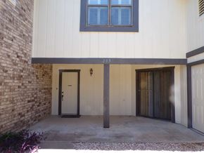 Marble Falls apartment for rent - A house numbered 205 with a white garage door.