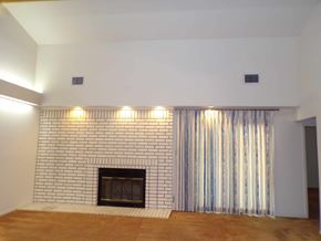Marble Falls apartment for rent - A fireplace with a striped curtain on the side.