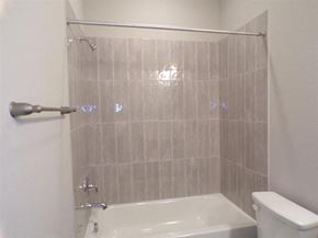 Marble Falls apartment for rent - a white bathroom with a shower and a toilet