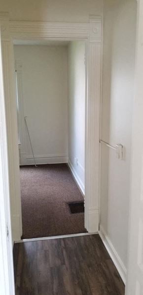 Warren apartment for rent - a hallway with a door to a room with white walls