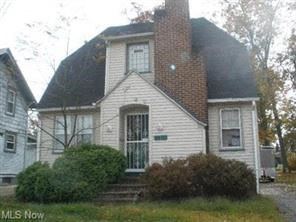 Warren house for rent - A house with a white siding and a brick chimney is for sale.