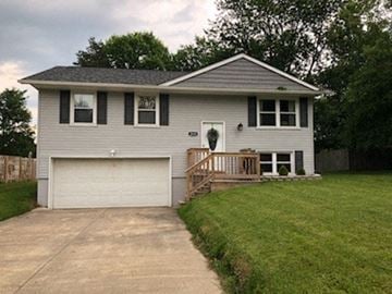 Warren, Oh house for rent - a white house with a porch and a driveway