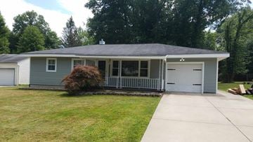 Warren house for rent - a blue house with a driveway and a white garage door