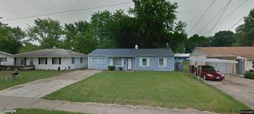 Warren house for rent - a blue house and a red car parked in a yard