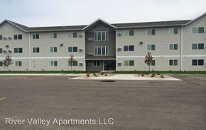 North Sioux City apartment for rent - an apartment building with a fire hydrant in a parking lot