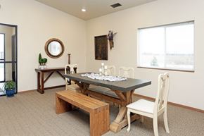 North Sioux City apartment for rent - a dining room with a table and chairs and a window