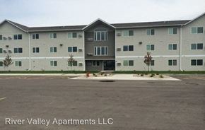 North Sioux City apartment for rent - an apartment building with a fire hydrant in a parking lot