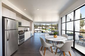 Los Angeles apartment for rent - a kitchen with stainless steel appliances and a table and chairs