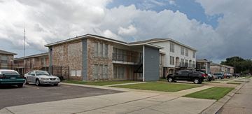 Gretna apartment for rent - a building with cars parked in front of it