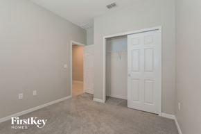 Bartow house for rent - a bedroom with a closet and a door to a closet