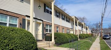 Maple Shade apartment for rent - a row of brick and white apartment buildings on a sidewalk