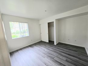 Wildomar multi-family for rent - A room with a wooden floor and a window.