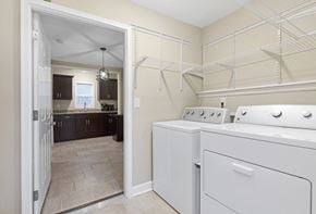 Nashville house for rent - a white washer and dryer in a laundry room next to a kitchen