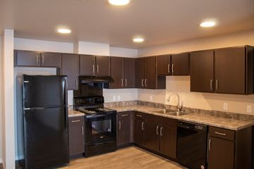 Jamestown apartment for rent - a kitchen with black appliances and granite counter tops