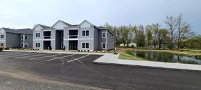 Holland apartment for rent - a large parking lot in front of an apartment building