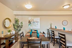 Ellensburg apartment for rent - a dining room with a long table and chairs