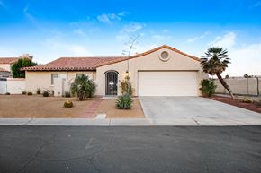 Cathedral City house for rent - A house with a red tile roof and a white garage door.