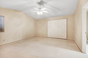 Cathedral City house for rent - A room with a ceiling fan and a window with blinds.